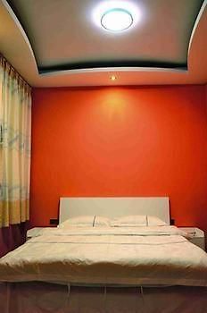 Fenghuang Yiguangnian Fashion Hotel Bagian luar foto